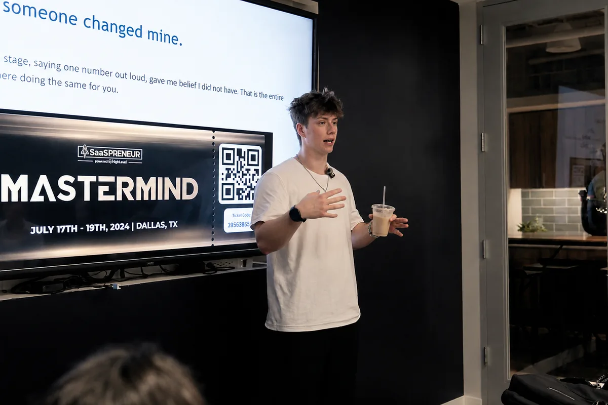 Cody Cavenaugh, founder of Cavenaugh Media, speaking at a SaaSpreneur Mastermind event